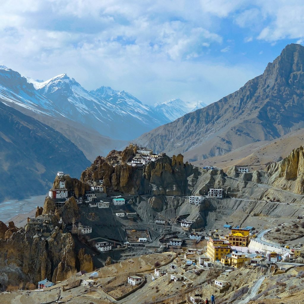 Dhankar Monastery perched on a cliff during the winter Spiti expedition, surrounded by snow-dusted mountains.