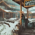 Snow-covered outdoor seating area of Johnson’s Cafe in Manali with a person standing holding a hot drink.